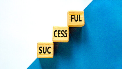 Successful symbol. Concept word Successful on beautiful wooden blocks. Beautiful blue and white background. Business successful concept. Copy space.