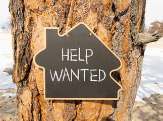 Wall Mural - Help wanted and support symbol. Concept words Help wanted on beautiful black house blackboard. Beautiful tree background. Business, support, help wanted concept. Copy space.
