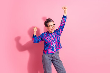 Poster - Photo portrait of pretty retired female raise fists winning wear blue colorful outfit isolated on pink color background