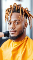 A man with dreadlocks, having his hair retwisted by a stylist, capturing the care and attention to maintaining his hairstyle