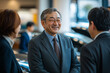 © Chin - Portrait of group of businessman in car showroom, Group of colleague smiling together, Selective focus chief executive officer talking and discussion with employee.