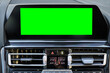 © R_Yosha - Monitor in car isolated blank screen for navigation maps and GPS rearview camera and parking assistant. Car display with blank green screen for design mock up, copy space.