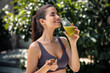 © nenetus - Helthy young woman drinking detox juice in the garden