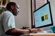 © peopleimages.com - Business, black man and graphic designer on computer in office for creative startup logo design. Website, screen and artist working on project for social media platform, update or development online