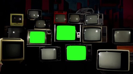 Wall Mural - five vintage tvs turning on green screens in a stack of 80s and 90s models - 4k resolution