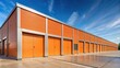 © Sayfar - Orange storage facility with large doors and windows for lease, facility, storage, modern, empty, exterior architecture, space, business, exterior, exterior design, entrance, lease