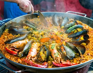 Wall Mural - colorful paella freshly made with rice and sea food in a large pot