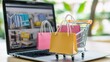 © Harjo - Product package boxes and shopping bag in cart with laptop computer which web store shop on screen for online shopping and delivery very beautiful concept