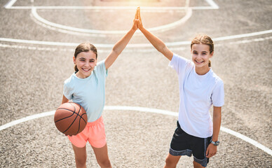 two childs girls in sportswear playing basketball game