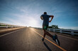 © sutadimages - runners is running on the road at outdoors , healthy lifestyle and sport concepts.