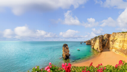 A view of the beach and coastline at Praia da Marinha, Algarve, Portugal.	
