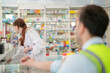 © ultramansk - pharmacist engages with a customer offering guidance on medication usage. emphasizes the critical role of pharmacists in ensuring patient engineer worker safety and delivering personalized healthcare.