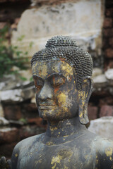 Face of outdoor black the Buddha  standing decorated at Sermon Hall ( Vihara ). Located at Wat Thammickarat in Ayutthaya Historical Park in Thailand.