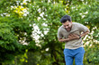 © Tetiana - Young sportsman experiencing chest pain during outdoor exercise in park setting
