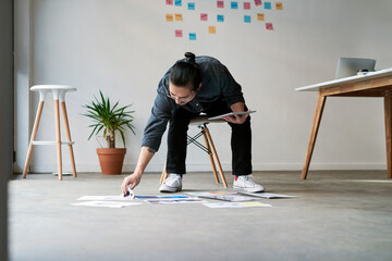 Poster - Reading, business man and tablet with paperwork for creative solution, planning or problem solving. Idea, tech or interior designer thinking of inspiration, decision or project with document on floor