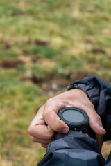 Wall Mural - Male hands using an smartwatch, outdoors