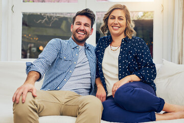 Poster - Happy couple, portrait and relax with sofa for weekend, bonding or fun holiday together at home. Young man, woman or lovers with smile on couch for relationship, marriage or commitment at house