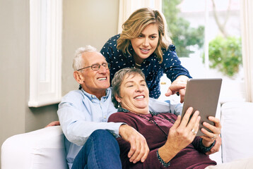 Poster - Woman, tablet and elderly couple on sofa for help, learning and showing new app at home. Senior parents, daughter and tech in living room for communication, streaming and relax on couch with media