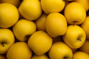 yellow fresh apples in bulk, top view