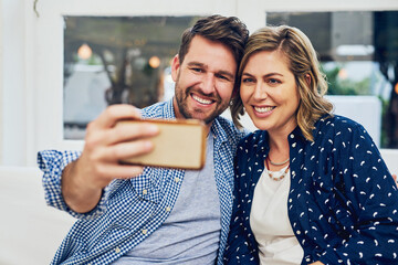 Poster - Happy couple, relax and hug with selfie on sofa for photography, picture or memory at home. Young man, woman or lovers with smile for holiday, bonding moment or weekend together on couch at house