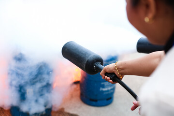 Employees firefighting training, Concept Employees hand using fire extinguisher fighting fire closeup	
