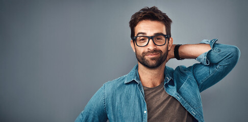 Fototapete - Business confidence, man and portrait with stretching for relax, satisfied or comfortable on break. Professional, designer or person with smile for career pride on studio background with mockup space