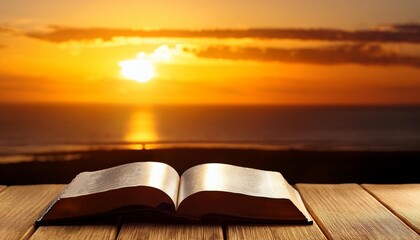 dramatic scene with a bible on a wooden surface against a sunset signaling the end of a day and the contemplation it brings