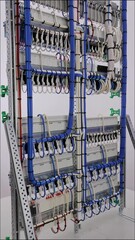 Sticker - Connecting electrical modules using insulated wires in an electrical distribution cabinet. Close-up.