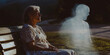 © IndigoElf - Old woman sits on a park bench next to a shadowy ghost of a man. Concept of loss of loved ones, loneliness and death