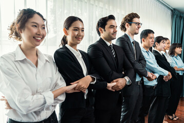 Modern diversity and multicultural company, business people joining hand together and standing in line, shared commitment to collaboration and cooperation concept background. Meticulous