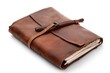 © Fotograf - A brown leather journal with a leather strap
