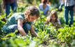 © AZ Studio - Community engagement in a vibrant garden as families cultivate crops and foster sustainability together