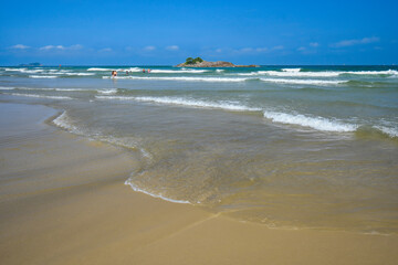 Wall Mural - Beautiful blue sky morning at Pitangueiras beach. Beach on downtown of Guaruja, SP, Brazil.