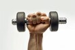 © Fotograf - A hand holding a pair of dumbbells, great for fitness and workout illustrations