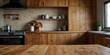 © Александр Поташев - Modern kitchen made of natural wood.The table is in the foreground. A place for labels, kitchen sets and groceries.