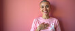 © Mr.Pancho Store - Turkish female smiling and wearing a pink shirt with cancer awareness white ribbon on it
