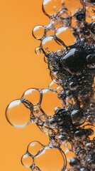 Wall Mural - Black Soap Bubbles on Orange Background, Abstract Image, Texture, Pattern, Wallpaper, Cover and Screen for Smartphone, PC, Laptop, 9:16 and 16:9 Format