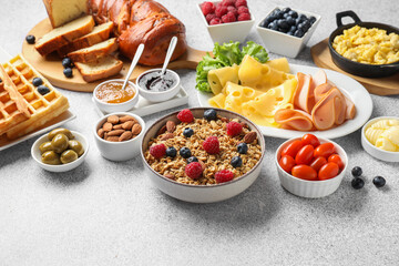 Poster - Tasty breakfast. Granola with berries and other food on grey textured table