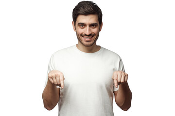 Wall Mural - Attractive young man in white t-shirt pointing down with two fingers