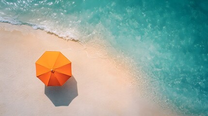 Aerial View of Vibrant Orange Beach Umbrella on Captivating Turquoise Coastline