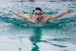 © Jack Tamrong - Professional Asian male swimmer swimming in pool