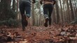 © Togrul - Couple's low angle run in forest