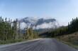 © primestockphotograpy - outdoor nature landscape with mountains and clouds and forest
