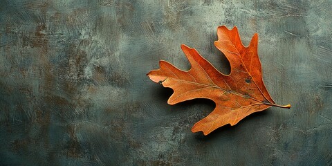 Poster - Single orange oak leaf on a textured background. 