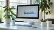 © KN Studio - Data-Driven Workspace: A pristine white desk featuring a computer displaying intricate financial charts, embodying the essence of modern business analysis in a bright, airy office setting.