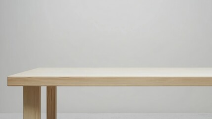 Empty wooden white table over white wall background