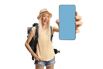 Wall Mural - Female backpacker holding a smartphone with blue screen