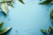© ratcha - Serene blue background framed by lush green leaves and gentle water ripples, perfect for nature-themed designs or calming visuals.