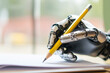 © ArtSav - Bionic hand writes with a pencil on paper, artificial intelligence concept, copyspace