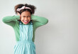 © CourtH/peopleimages.com - Loud, studio and child cover ears by mockup space for sound with ADHD, scared or autism spectrum. Neurodivergent, anxiety and girl kid with noise blocking for sensory sensitivity by white background.